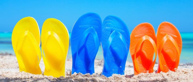 Assorted multi-coloured flipflops.